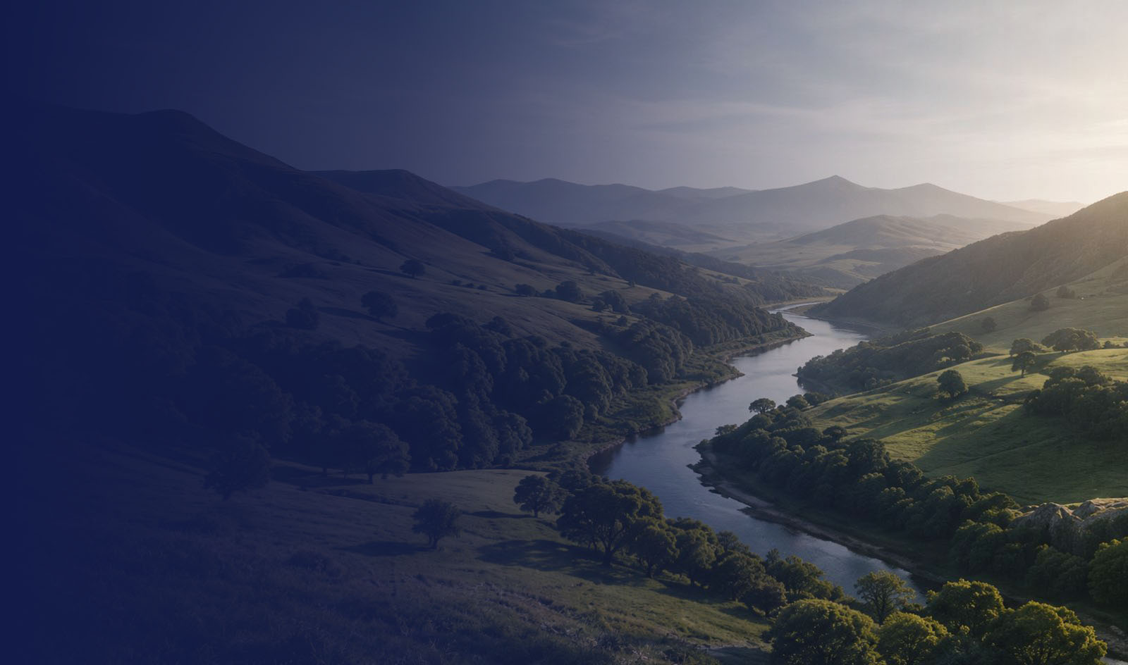 A river winding through green valleys at first light